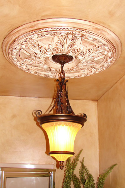 Faux finish around a light fixture.